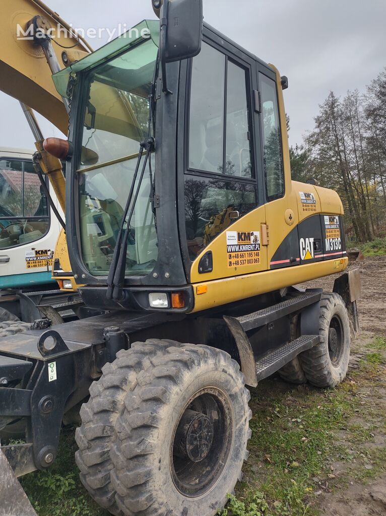 Caterpillar M313 bager točkaš